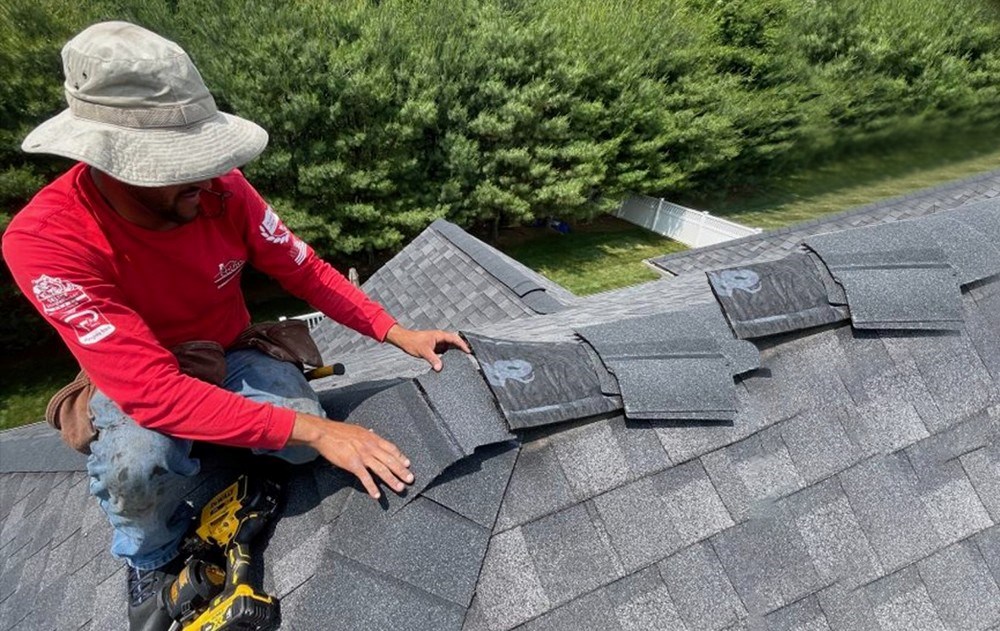 our roofer tuning up a home in massachusetts